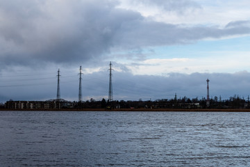 storm clouds forming over clear sea beach with rocks and clear sand