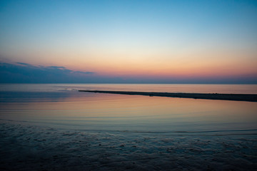 Obraz premium calm blue sunset over clear water in baltic sea