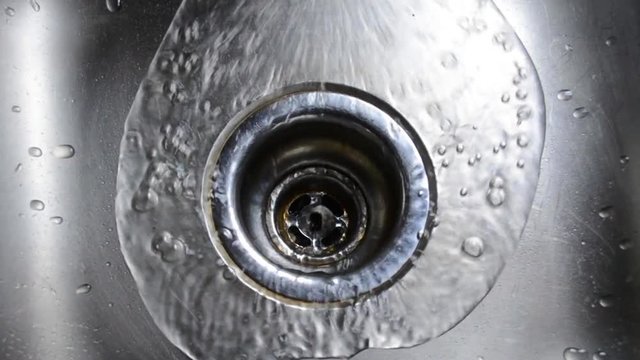 It's a metaphor for many of our lives, or just a great shot of water going down the drain.of a very shiny stainless steel kitchen sink Hey, whatever you need.