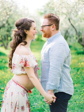 Loving happy couple in expectancy
