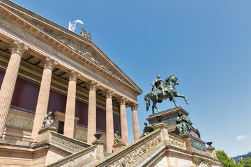 Fototapeta na wymiar Statue of King Wilhelm and Old National Gallery. Berlin, Germany