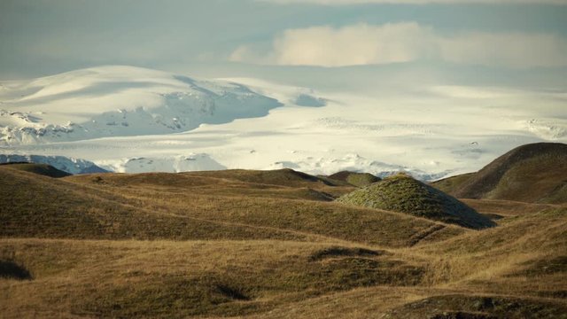 Bird flying over undulating glacial terrian below Vatnajokull Glacier, Iceland.mov