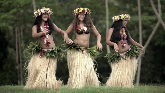 Young Polynesian Female Group Of Tahitian Hula Dancers Performing Outdoor Barefoot In Traditional Costume Tahiti French Polynesia South Pacific