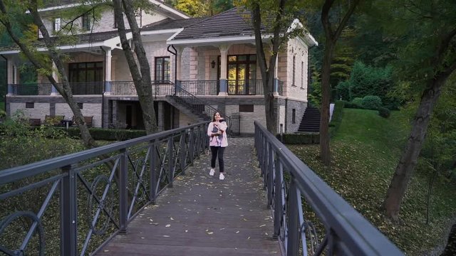 mother and daughter are on the bridge