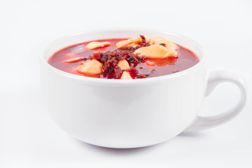Traditional polish Christmas Eve dish: red borscht with uszka (a mushroom filled kind of dumplings)