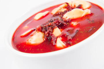 Traditional polish Christmas Eve dish: red borscht with uszka a mushroom filled kind of dumpling 