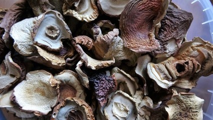 Walnuts whole and cracked in old baskets. Close-up, healthy food with rustic background