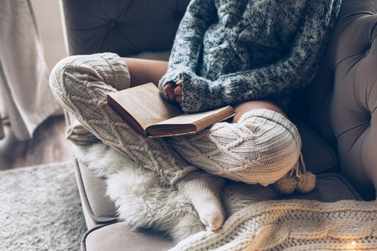 Girl reading and relaxing on a couch
