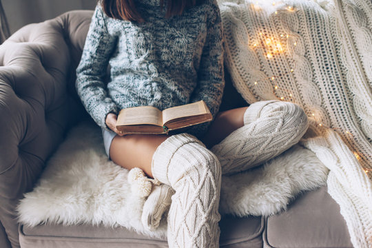 Girl reading and relaxing on a couch