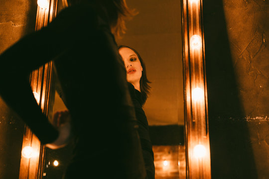 young androgyne man near the mirror