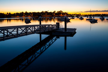 Fototapeta premium floating jetty, walkway, sunset, water sea.