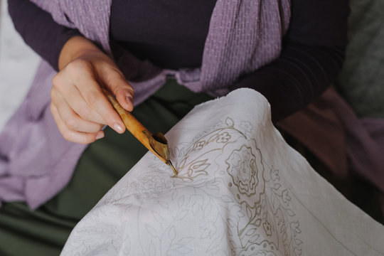 Female Artist Doing Batik Technique On The Piece Of Cloth