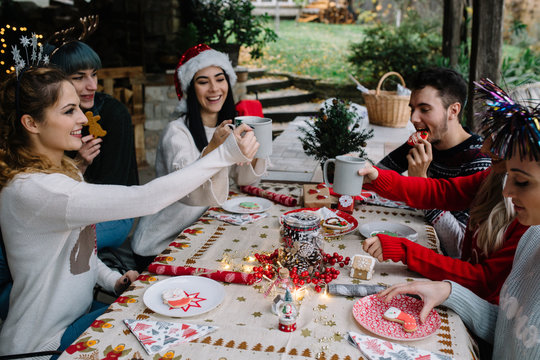 Group of friends spending time together at home for Christmas