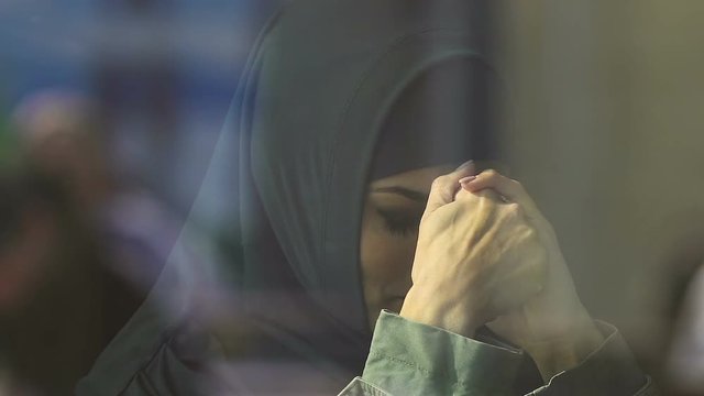 Muslim female immigrant crying, discrimination of refugees, migration crisis