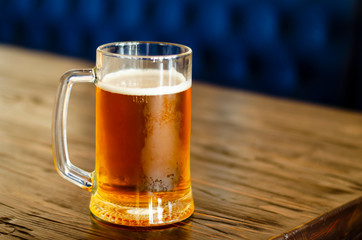a glass of light wheaten beer and fried peanuts. pints of beer. beer party. holiday with friends