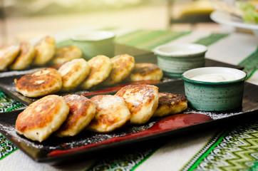 curd pancakes. Cheesecake with sour cream and strawberry sauce. cheese pancakes 