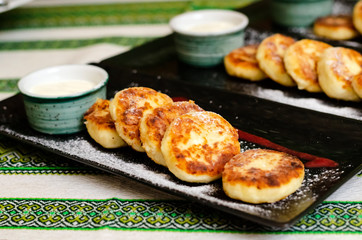 curd pancakes. Cheesecake with sour cream and strawberry sauce. cheese pancakes 