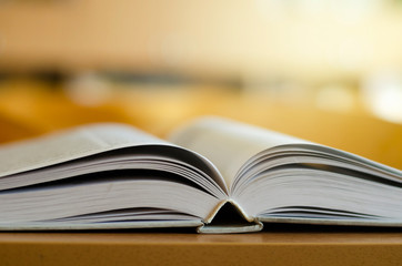 open book on wooden table. open book. the path to knowledge. soon to school. back to school. library