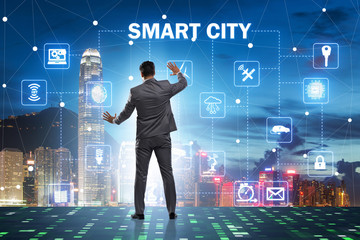 Concept of smart city with businessman pressing buttons