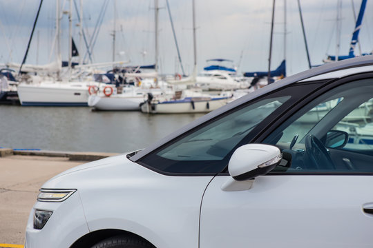 car on the beach near the marina