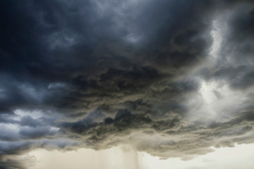 Naklejka na ściany i meble Light in the Dark and Dramatic Storm Clouds background