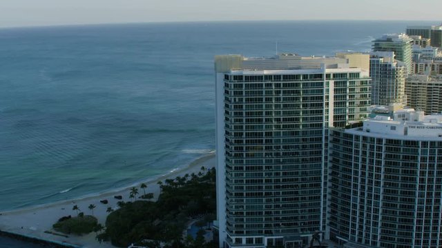 Aerial sunset view of the Ritz Carlton luxury tropical waterfront Condominium resort Bal Harbour Miami Beach Florida USA 