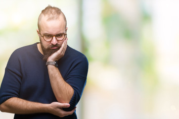 Young caucasian hipster man wearing sunglasses over isolated background thinking looking tired and bored with depression problems with crossed arms.