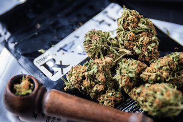 OG Kush medical marijuana prescription with wood pipe