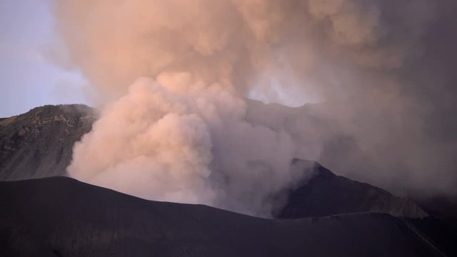 Smoke cloud erupting from Mt Bromo volcano Caldera National Park Java Indonesia