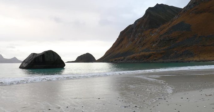 water splashing at Haukland beach, Lofoten, Norway in late fall