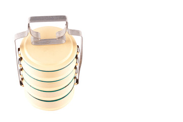yellow enamelled food carrier ( top view) on white background kitchenware object isolated