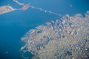 San Francisco financial district and the Bay Bridge as seen from an airplane on a clear sunny day