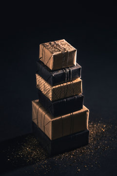 Pile of gifts on black background