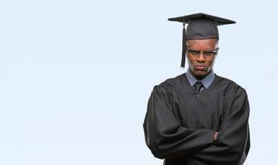 Young graduated african american man over isolated background skeptic and nervous, disapproving expression on face with crossed arms. Negative person.