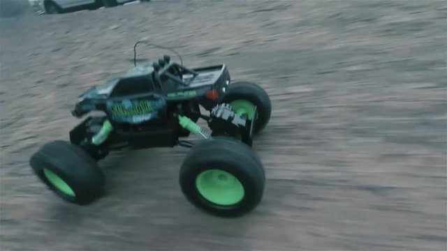 RC Truck Driving through neighborhood, through  dirt and sidewalks.