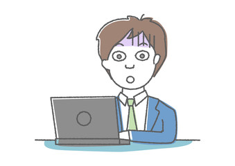 パソコンを見て驚き青ざめる男性