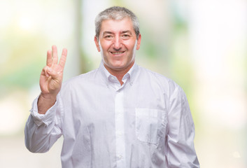 Handsome senior man over isolated background showing and pointing up with fingers number three while smiling confident and happy.