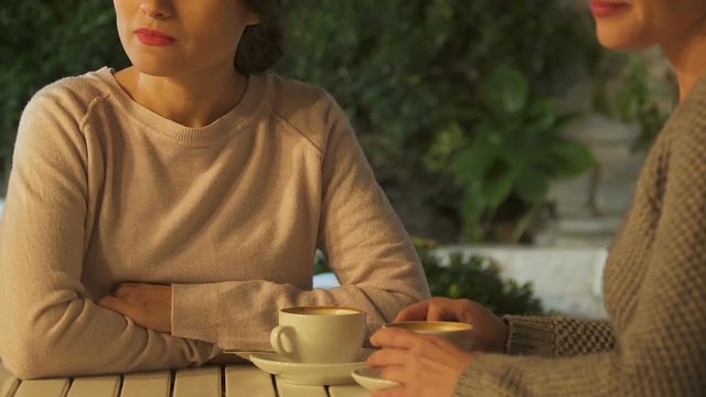 Crying woman blaming friend for betrayal, meanness and envy in friendship