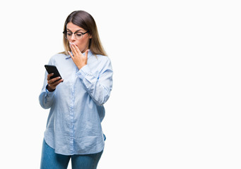 Young beautiful business woman texting message using smartphone over isolated background cover mouth with hand shocked with shame for mistake, expression of fear, scared in silence, secret concept