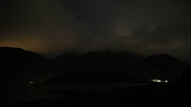 northern lights behing clouds on Lofoten, Norway timelapse