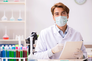 Young chemist working in the lab 