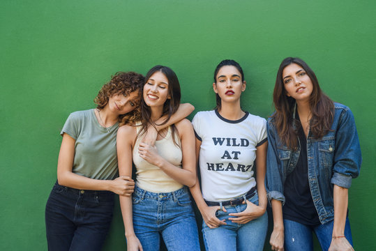 Confident trendy models posing together