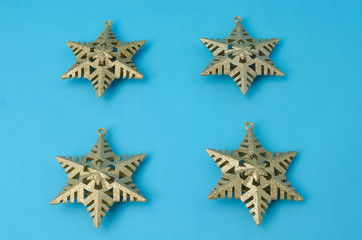 Golden stars against blue background. Golden stars for Christmas decoration. Christmas background