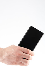 Close-up of back modern smartphone in hand