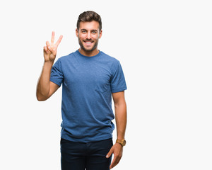 Naklejka premium Young handsome man over isolated background showing and pointing up with fingers number two while smiling confident and happy.