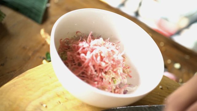 Preparation by hand of Basa gede using nutritious vegetables and chopping with traditional Blakas in Balinese kitchen