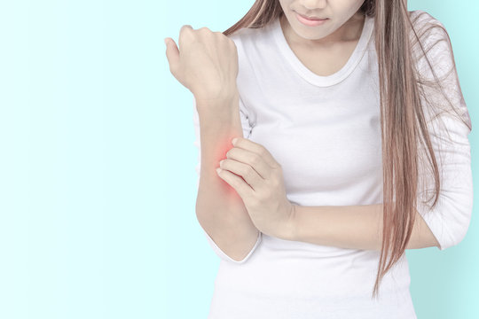 Woman Scratching Her Elbow.