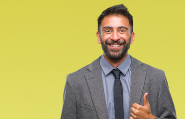 Adult hispanic business man over isolated background doing happy thumbs up gesture with hand. Approving expression looking at the camera with showing success.