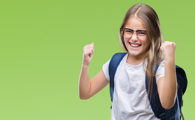 Young beautiful smart student girl wearing backpack over isolated background very happy and excited doing winner gesture with arms raised, smiling and screaming for success. Celebration concept.