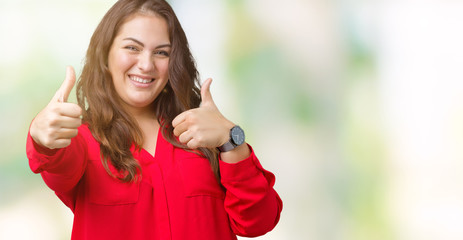 Beautiful plus size young business woman over isolated background approving doing positive gesture with hand, thumbs up smiling and happy for success. Looking at the camera, winner gesture.